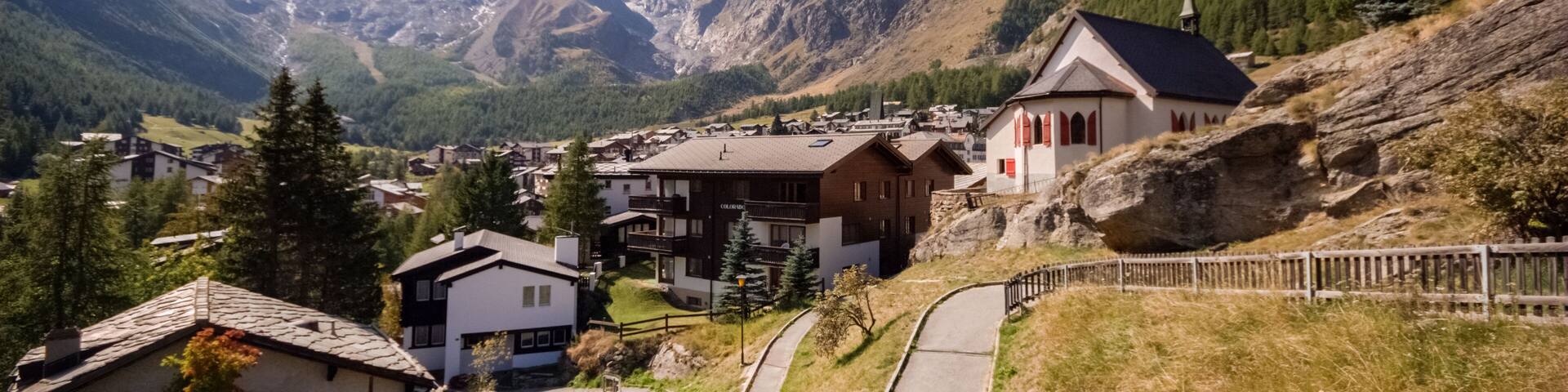 On a late september day the sun is shining on Saas-Fee, the main village in the Saastal, or the Saas Valley, and is a municipality in the district of Visp in the canton of Valais in Switzerland.