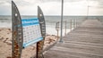 Normanville Beach featuring signage, general coastal views and a bridge