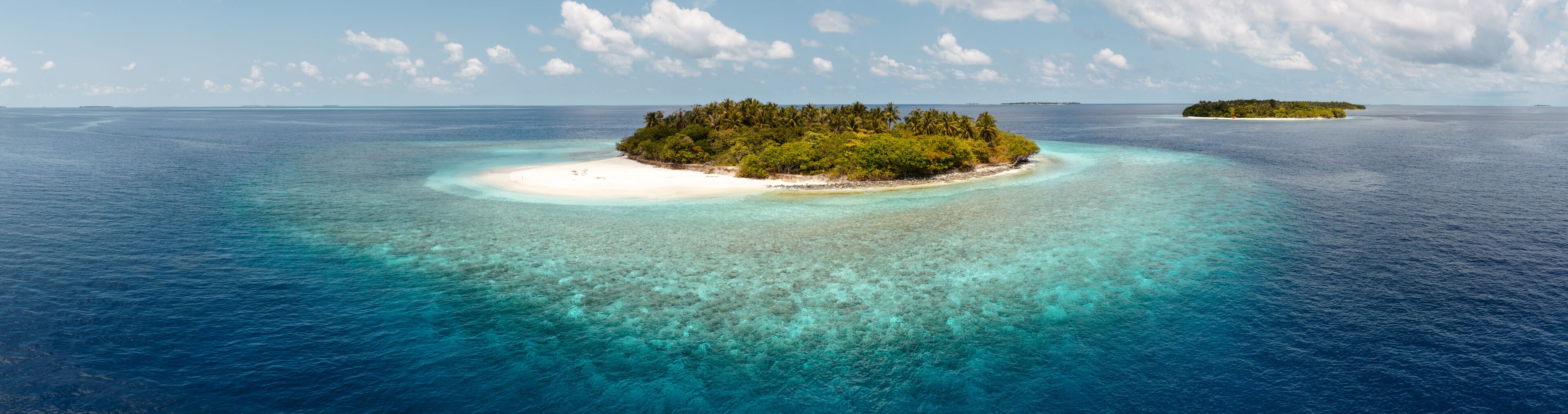Aerial panoramic view of small island in the Indian Ocean, Maldives