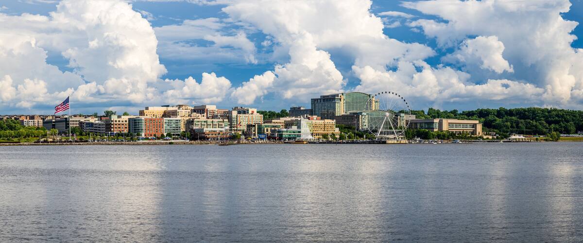 Dramatic summer clouds above panoramic skyline of National Harbor near Washington DC