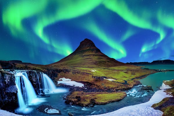 Northern Light, Aurora borealis at Kirkjufell in Iceland. Kirkjufell mountains in winter.