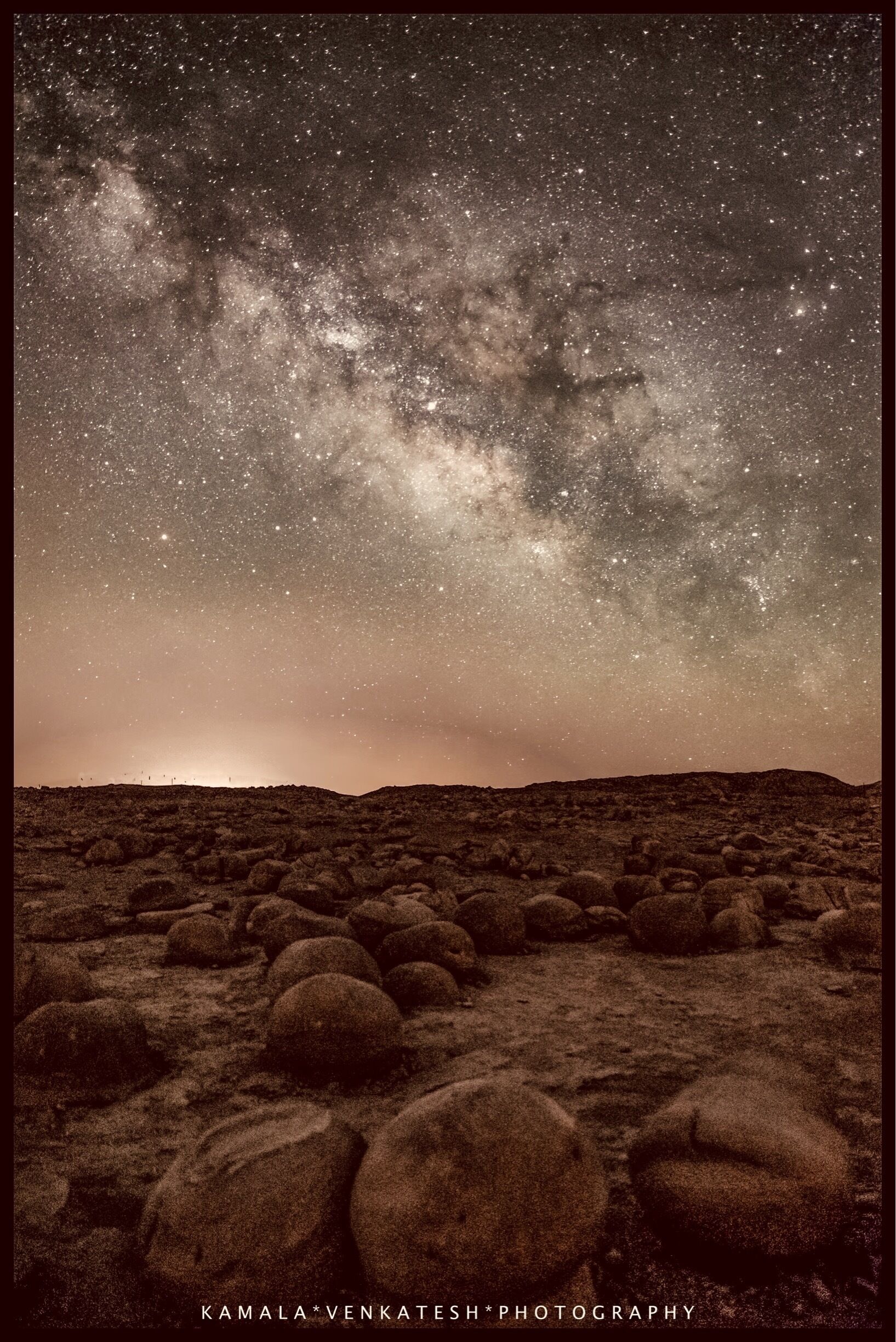 Rather lengthy, but please considering reading about this amazing and unique landscape!

Located just east of the Anza-Borrego State Park boundary is a unique geologic phenomenon known as the Pumpkin Patch.  Here, you’ll find a patch of land, covered with spherically-shaped rocks that look like pumpkins. 

One needs a high-clearance vehicle, a 4WD, because there are several stretches of sand in the washes. The terrain is pretty rough, mostly frequented by ATVs and dirt bikes. Only an adept driver can manage to drive on these rough paths!

The ‘pumpkins’ were created over the last four thousand years and are actually unique geological structures called ‘concretions’. They were formed very similar to how the pearls are created in nature. 

Formed in the Colorado river basin, the silt in the river bed created layers upon layers around a core of something as small as a pebble, leaf, stick, or a piece of bone. As the sand from the river washed away, here emerged the pumpkins and over millions of years, due to winds and other natural weather factors, became rounded in shape. Many of these concretions are over two feet in diameter.

Of course today, the terrain is very foreign-looking as if some aliens laid these rocks on purpose. 

It was a very fun trip, thanks to our friend Dan Warner, who was kind enough to drive us in his awesome brand-new specially modified truck very deftly over some harsh terrain!

We camped alongside the pumpkins (fenced off to protect them from vandalism), waking up at 1 am to shoot the rising Milky Way. It was fun sharing this experience with a few photog friends!

Personally, it was my very first time camping, EVER, and it was a beautiful experience sleeping under a very dark sky with a canopy of twinkling stars! An experience of a life-time for this senior! 

I bring you Milky Way over the Anza Borrego Desert in California. 

Oh What A Night!!!