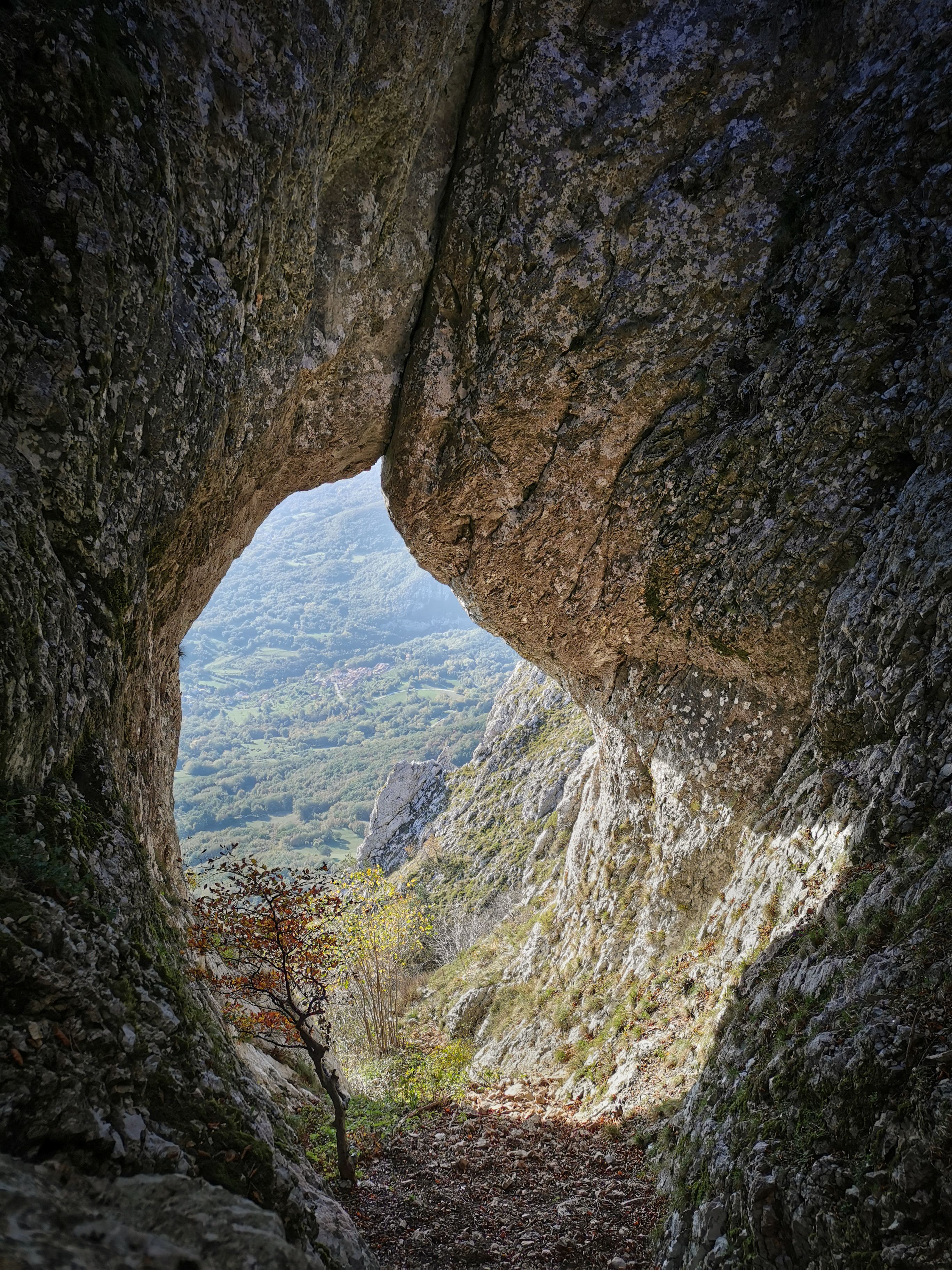 A natural rock formation with a cave-like opening.