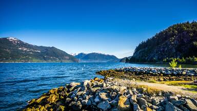 The waters of Howe Sound and surrounding mountains along Highway 99 between Vancouver and Squamish, British Columbia. Viewed from the Porteau Cove ferry docks