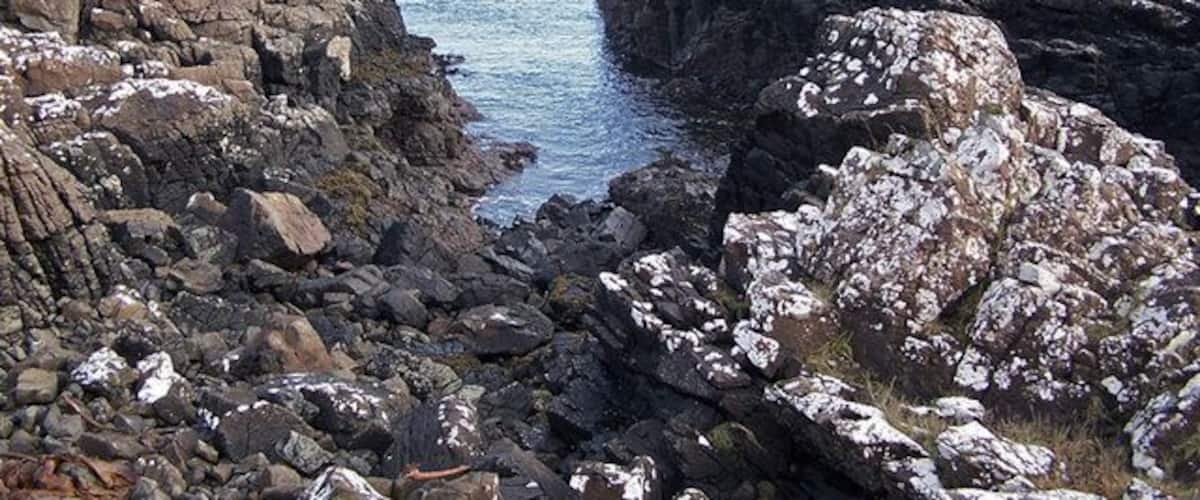 Rocky shore The basalt rock shore of Loch Caroy east of Ardmore on the Harlosh peninsula.