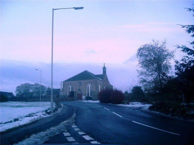 Early winter in Kirkton of Skene Church corner with snow about.