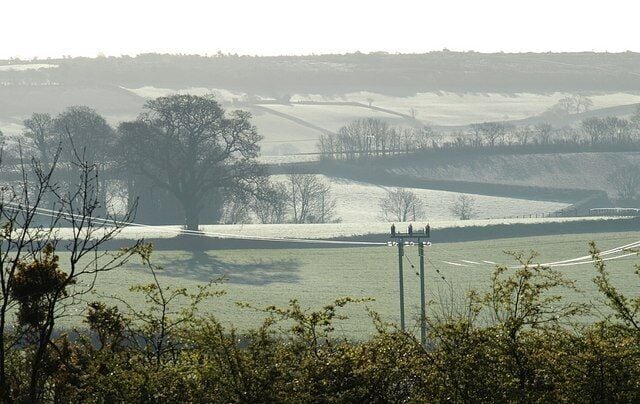 Countryside east of Olchard A frosty morning in Devon. This is a view from a layby on the A380 beside Ugbrooke New Lodge towards Hamblecombe Lane, with Little Haldon on the skyline.