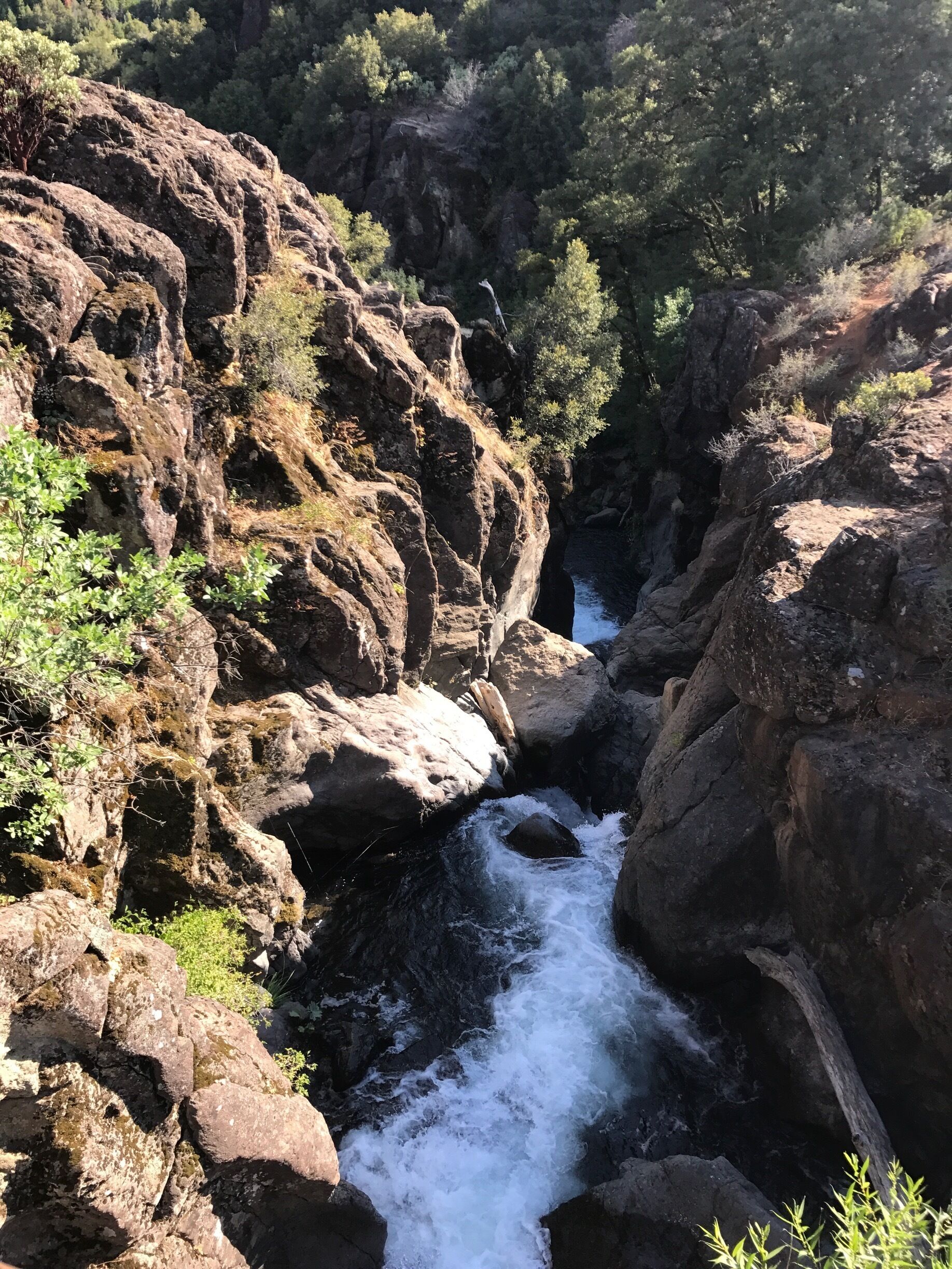 On the west side of hwy 299 just several hundred feet down Montgomery Creek Falls Rd. and you can stand on the wooden bridge and this is the view 