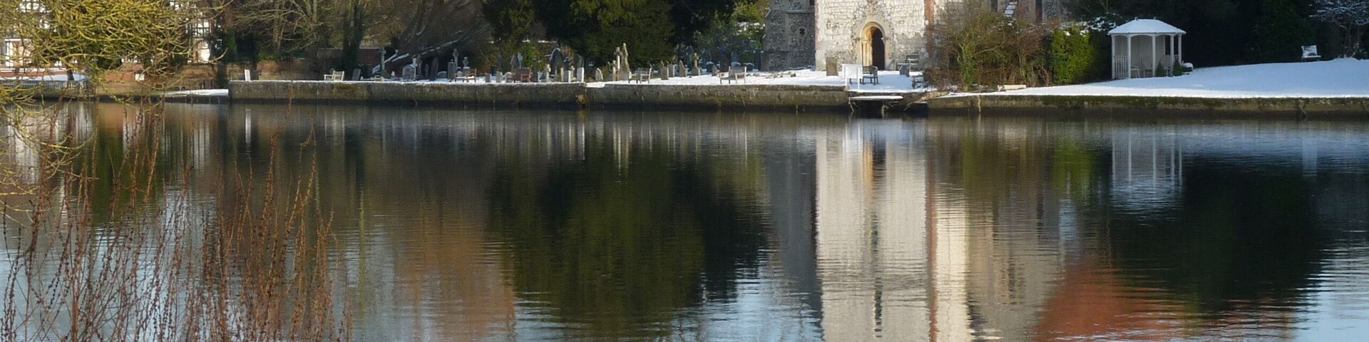 All Saints' parish church, Bisham, Berkshire, England, seen from the southwest from across the River Thames