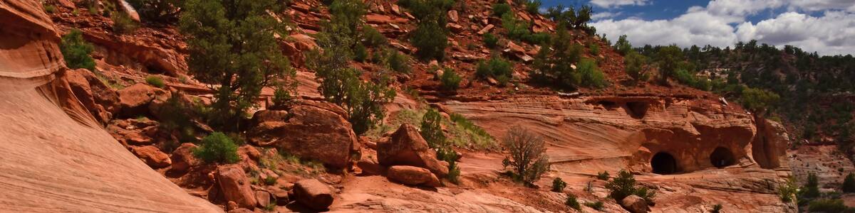 hiking the slick rock out to the man-made kanab sand caves along utah state highway 89. north of kanab, utah, on a sunny summer day