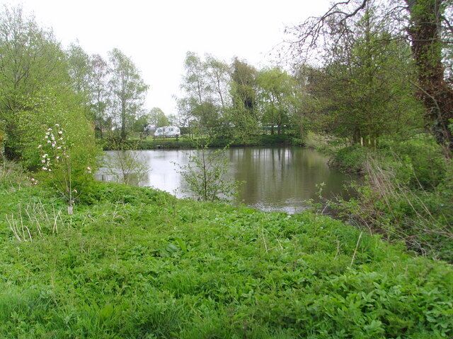 Duck pond near Sutton House There is a caravan and camping site in the fields around this pond.