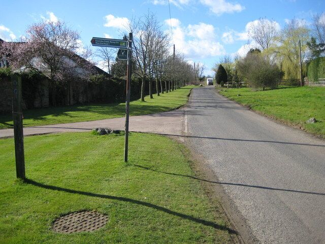 West End: West End Lane Not the West End, but the grass verge on the left has been neatly mown in this hamlet of farms (West End, Lower West End and Upper West End). The finger post indicates a Public Byway to Essendon.