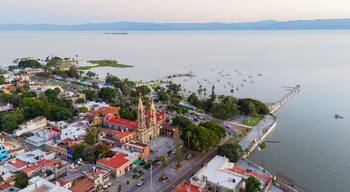Aerial view of Chapala at sunset with its historic center and pier along the lake. Jalisco, Mexico