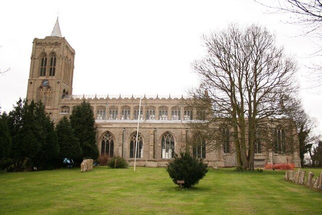 A large church with a prominent tower and arched windows.