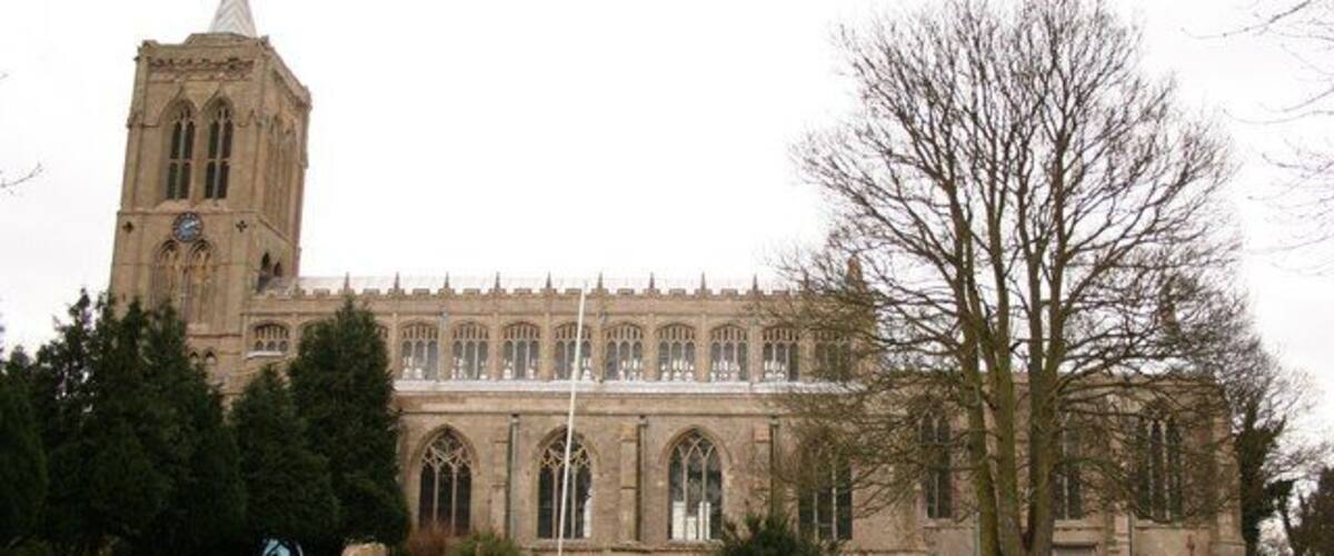 A large church with a prominent tower and arched windows.