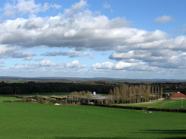 Wales Farm A working farm owned by neighbouring Plumpton Agricultural College. The field in the foreground is Wales Laine as is the one beyond the hedge which marks the boundary between the parishes of Streat and Plumpton. The rising ground and clear day allows for views over the Weald in the direction of Ashdown Forest.