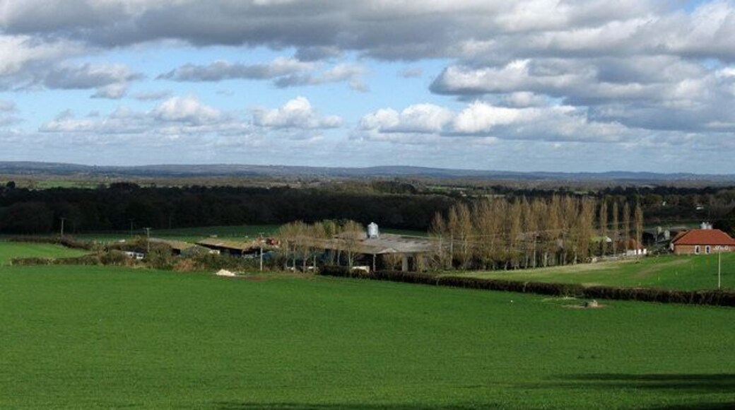 Wales Farm A working farm owned by neighbouring Plumpton Agricultural College. The field in the foreground is Wales Laine as is the one beyond the hedge which marks the boundary between the parishes of Streat and Plumpton. The rising ground and clear day allows for views over the Weald in the direction of Ashdown Forest.
