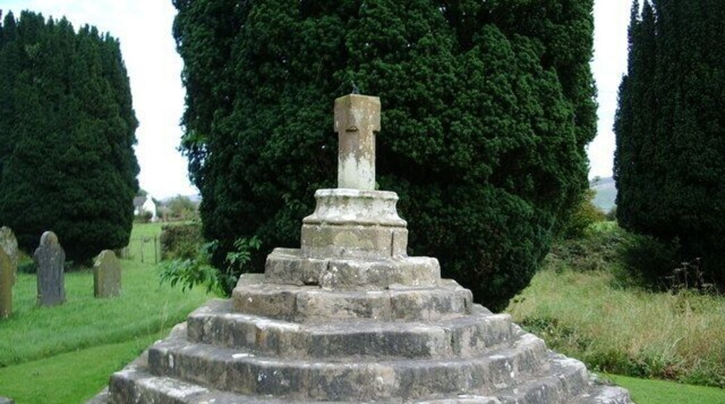 Stone cross in St Oswald's parish churchyard, Dean, Cumbria, England