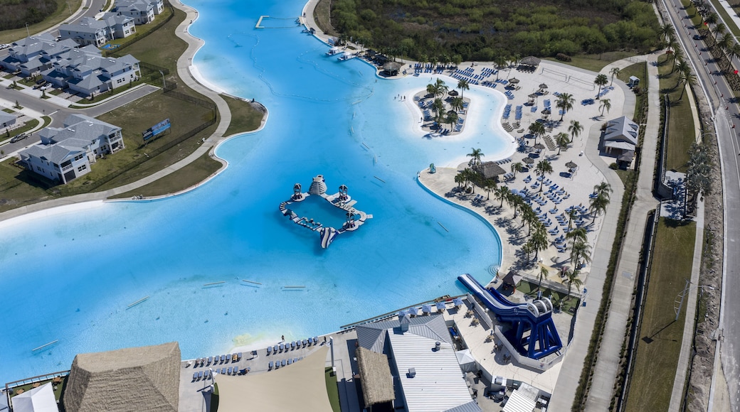 Wesley Chapel, United States - 02 March 2026: Aerial view of Epperson Lagoon with its turquoise water, white sandy beaches, and surrounding residential neighborhood.