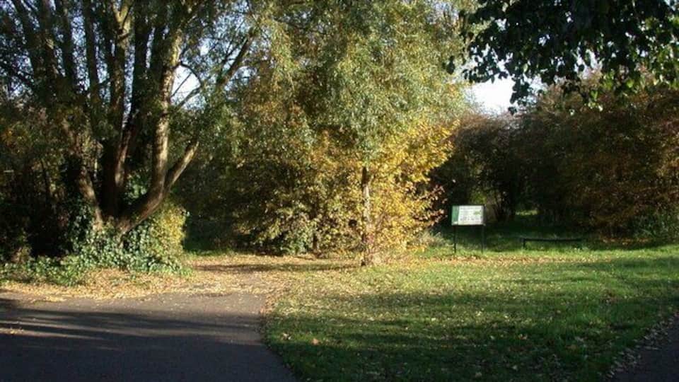 Entrance to Bramblefields local nature reserve "At the turn of the 20th Century this region was fen and farmland. More recently it was used as allotments but these were abandoned after poor yields. Today Bramblefields provides an idyllic haven for wildlife and people in the midst of a residential area. Local Nature Reserve status has helped safeguard the site from future development and with it a commitment to protecting its wildlife and community value."-From the Welcome notice.
