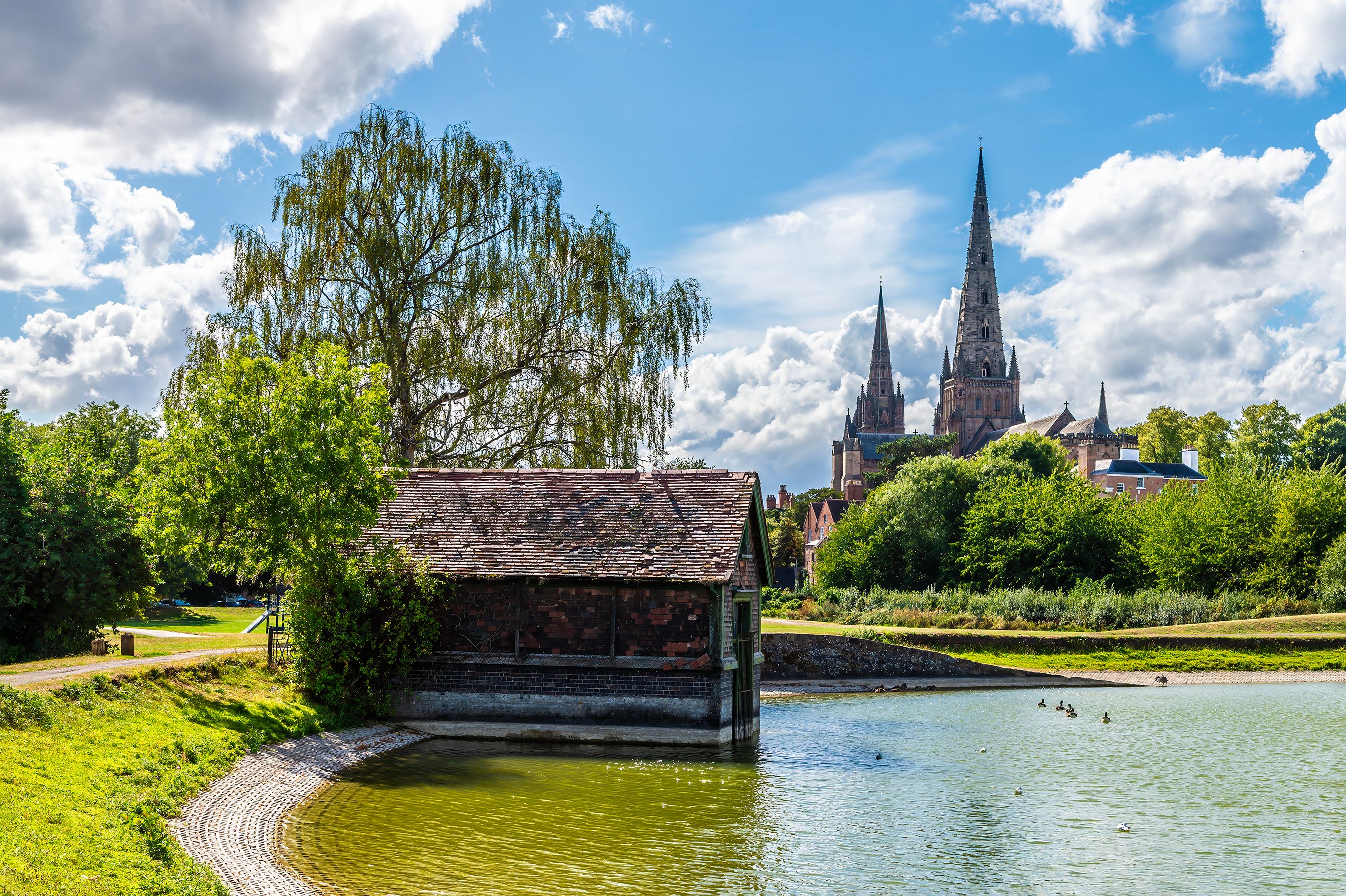 A view past the end of Stowe Pool towards the Cathedral in Lichfield, UK in summertime