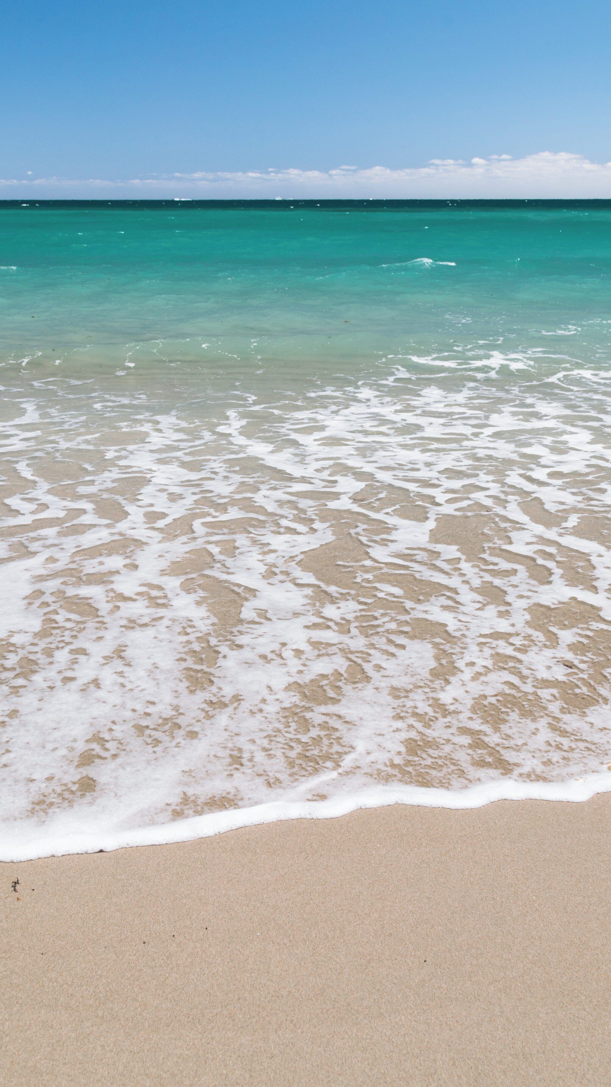 Beautiful day at Hollywood North Beach Park with gentle waves and clear skies in Hollywood, Florida