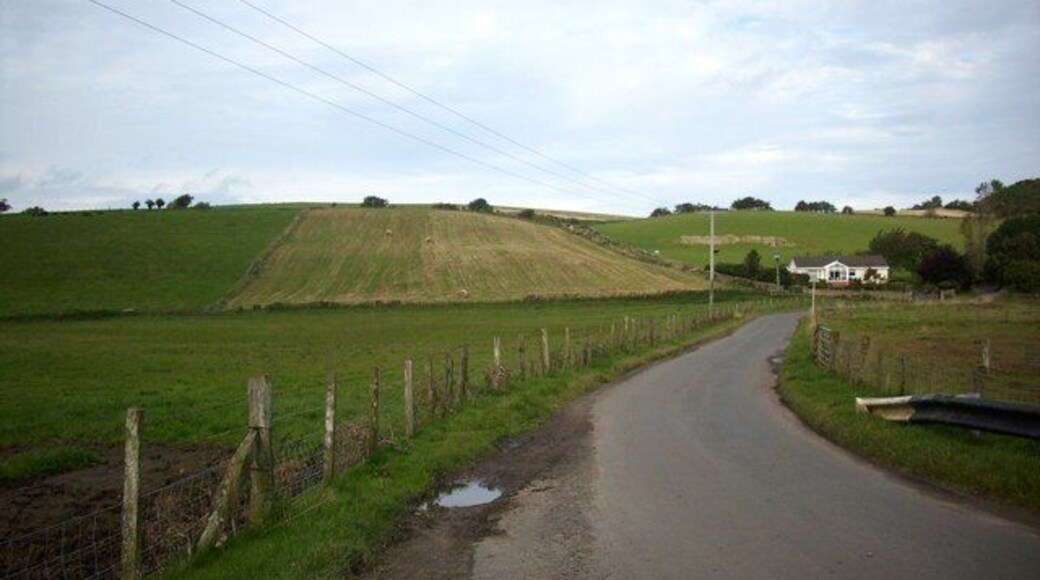 Lonely cottage on country road The road through Borthwick in Mid Lothian.