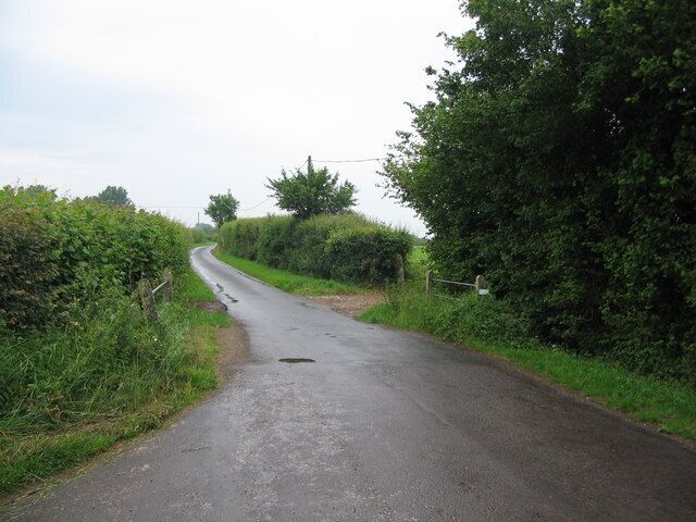 Stocking Bridge A view looking to the northeast along Church Road towards Stocking Bridge. The stream passing under the bridge is a tributary of the River Stour.