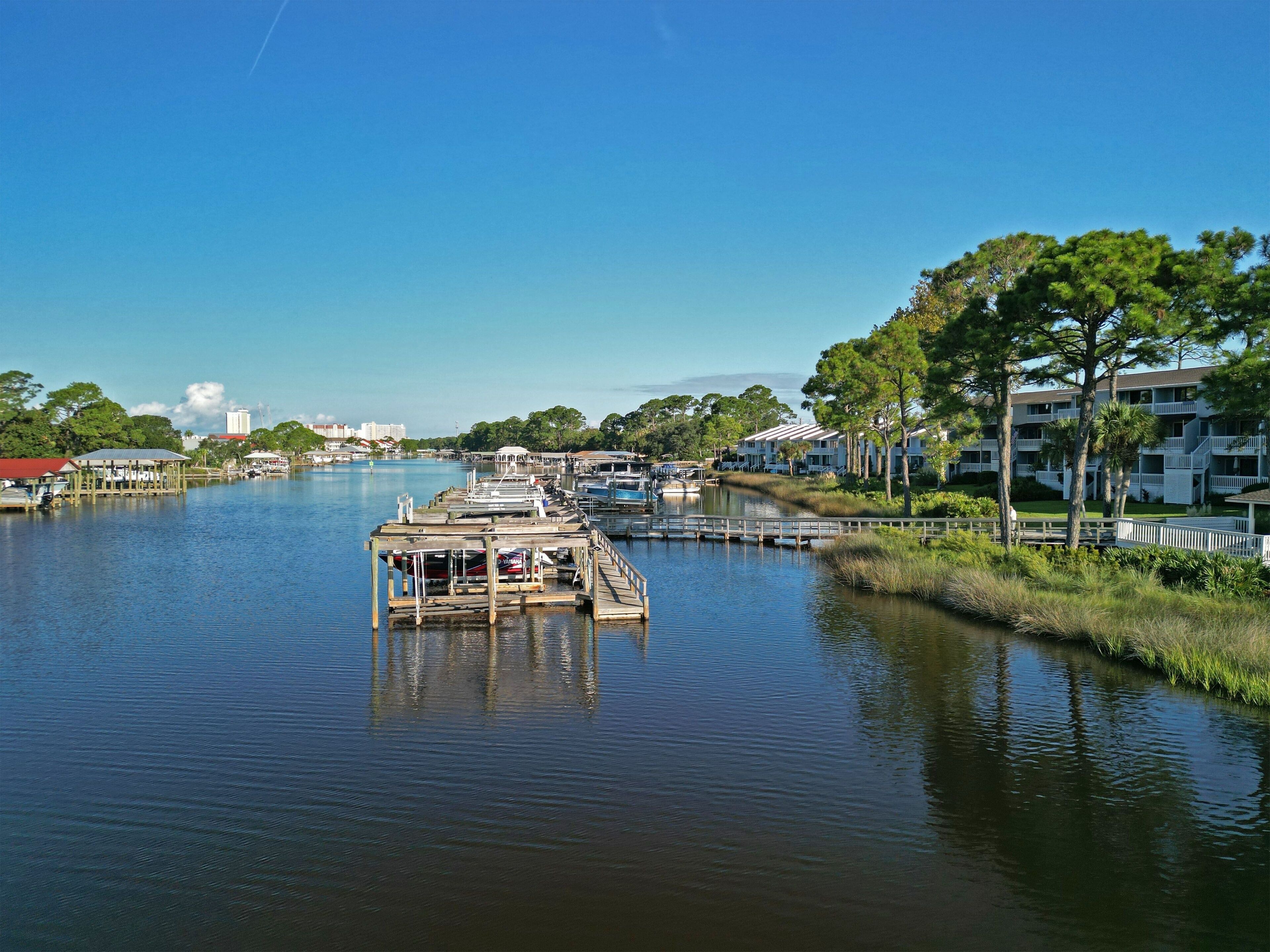 Beautiful wooden pier above a river in the Lower Grand Lagoon, Panama City Beach, Florida