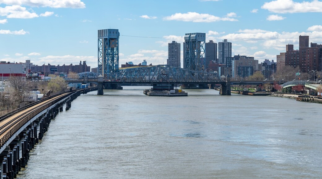 Looking southward along the Harlem River at the Madison Avenue Bridge in Harlem, NYC, USA