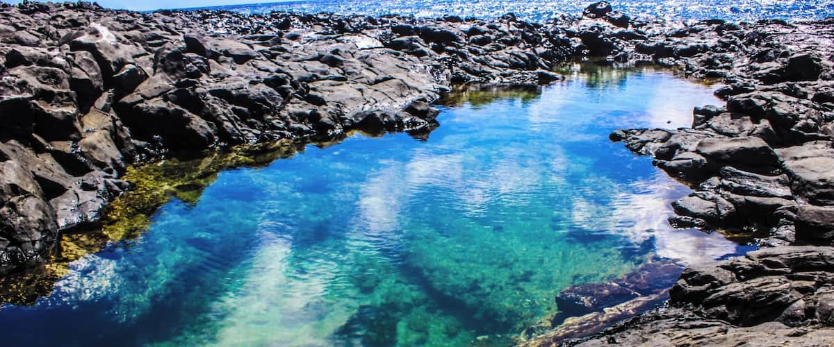 This is a very hard place to find if you do not know where to turn off the hike. To find this you'll need to hike Makapu'u Lighthouse, but will need to take a turn off the trail and down a cliff. This could be dangerous, so make sure that you go with someone experienced and to check the tide. If the tide is high, DO NOT GO because the waves will break into the tide pools and possibly sweep you in the ocean. The view is beautiful and you see many fish swimming in the tide pools.