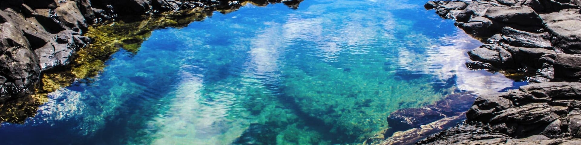 This is a very hard place to find if you do not know where to turn off the hike. To find this you'll need to hike Makapu'u Lighthouse, but will need to take a turn off the trail and down a cliff. This could be dangerous, so make sure that you go with someone experienced and to check the tide. If the tide is high, DO NOT GO because the waves will break into the tide pools and possibly sweep you in the ocean. The view is beautiful and you see many fish swimming in the tide pools.