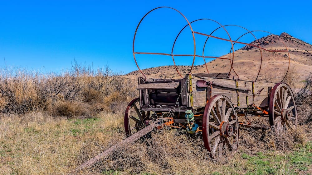 Old wagon standing with grace off National Back Country Byway ~ Highway 27 in NM.