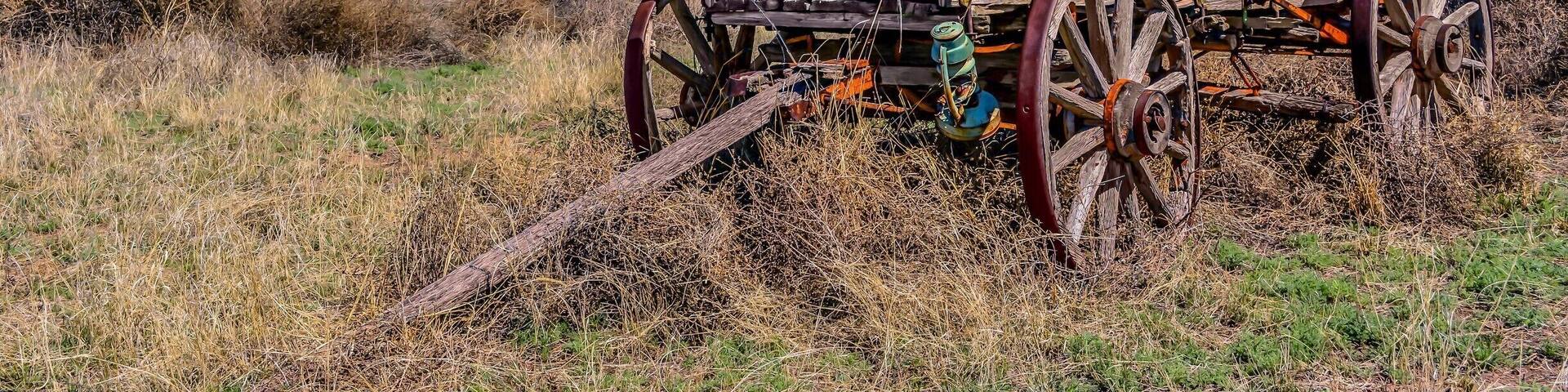 Old wagon standing with grace off National Back Country Byway ~ Highway 27 in NM.