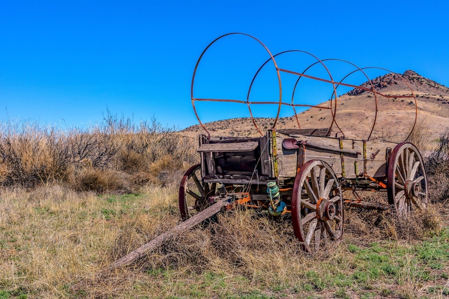 Old wagon standing with grace off National Back Country Byway ~ Highway 27 in NM.