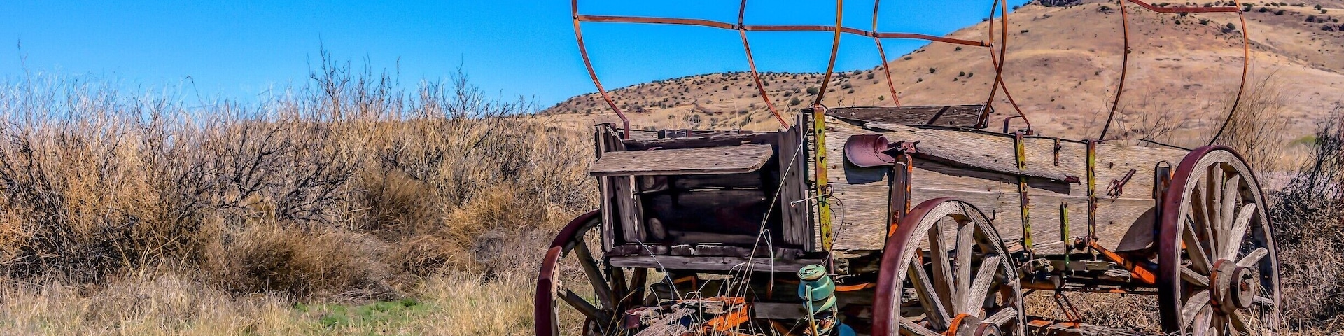 Old wagon standing with grace off National Back Country Byway ~ Highway 27 in NM.