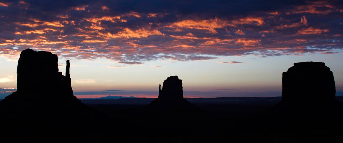 A sunset over rock formations.