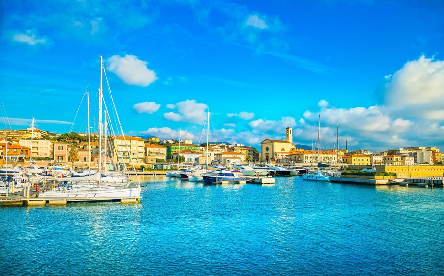M6AAEP San Vincenzo port or marina, church and seafront panoramic view. Tuscany, Italy Europa