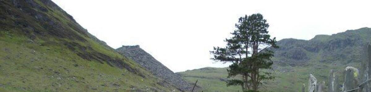 Chapel in ruins Behind the chapel is the massive waste heap from the higher Rhosydd Quarry. The track is bounded by a beautiful slate fence. Short sections of rail can be glimpsed in the track hidden under mud and waste stone.