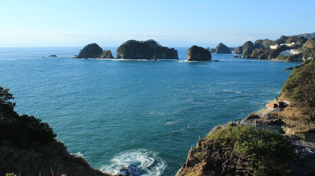 Dogashima coast with Sanshirojima (center) and the shack of outdoor hot spring of Sawada park (middle light), Nishiizu, Shizuoka prefecture, Japan.