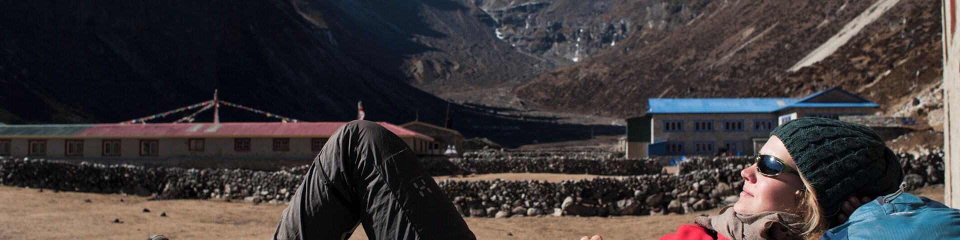 A trekker takes a break in the sun at Merchulu in the Everest region
