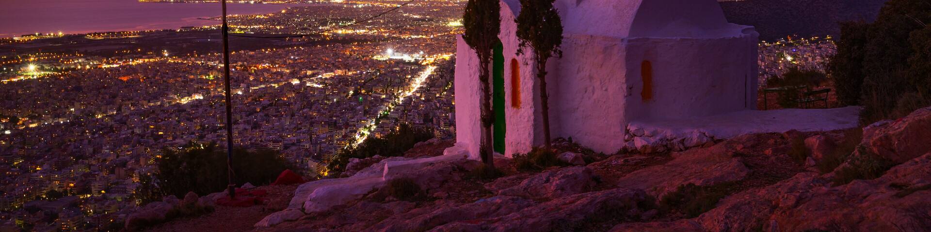 Prophetess Ilias church and view of Athens at dusk.