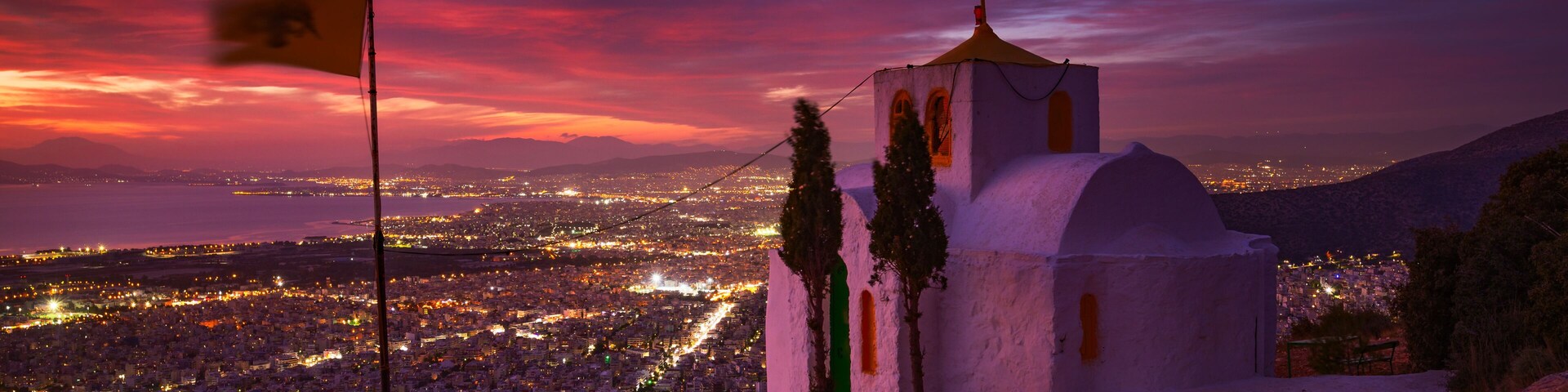 Prophetess Ilias church and view of Athens at dusk.