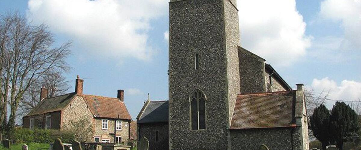 All Saints church and adjacent cottage. Viewed from across the churchyard. The church of All Saints was extensively restored in the late 1800s to early 1900s and the stained glass windows date from that time > 764504 - 764509 - 764511 - 764516. Older survivals are a monument to William Butt, d. 1583 > 764500, and a ledger stone set into the west wall, depicting Anne Heigham, the wife of Sir Clement Heigham, at her prayerdesk > 764497; she had eight children and died in 1590 at the age of 84. The church is open every day. For more information see : http://www.norfolkchurches.co.uk/thornage/thornage.htm