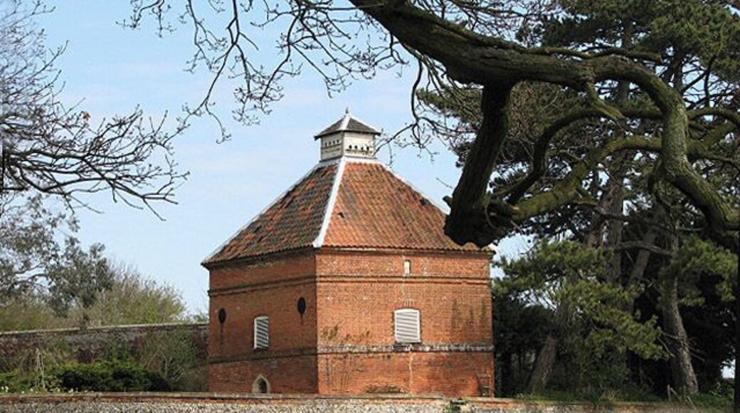 Thornage Hall - dovecote This large brick-built dovecote stands in the garden of Thornage Hall; it was built in 1728.