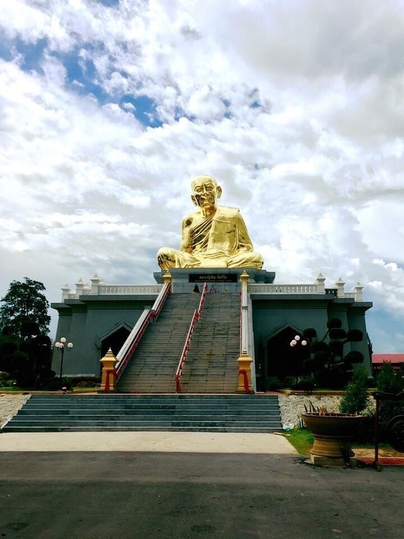 Random temple with giant monk statue in the back