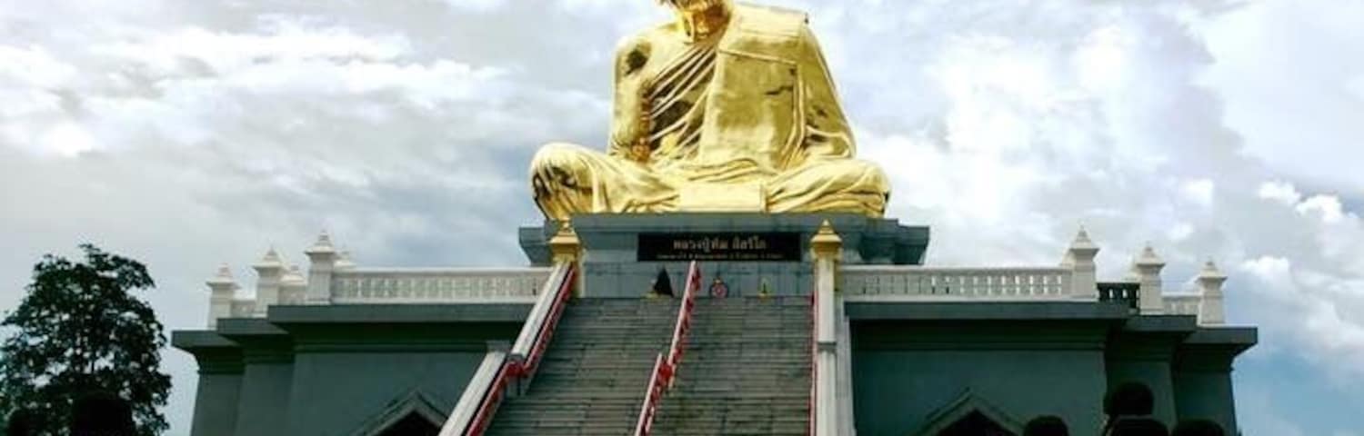 Random temple with giant monk statue in the back