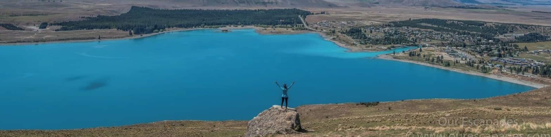 For an aerial view of Lake Tekapo, take a short 15-20 min drive up the hills to Mt. John Observatory.
Here is my blog post on my two favorite lakes in New Zealand:
http://ourescapades.com/blog/2016/01/06/my-two-favorite-lakes-in-new-zealand/