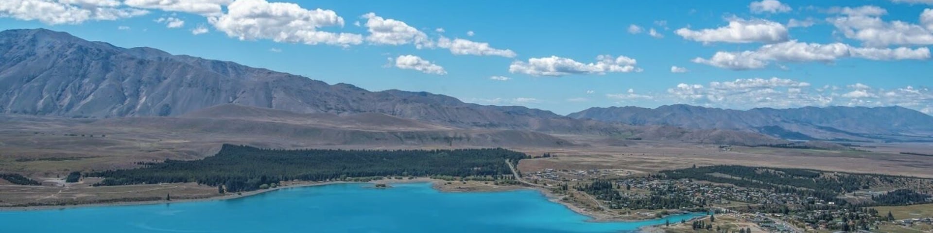 For an aerial view of Lake Tekapo, take a short 15-20 min drive up the hills to Mt. John Observatory.
Here is my blog post on my two favorite lakes in New Zealand:
http://ourescapades.com/blog/2016/01/06/my-two-favorite-lakes-in-new-zealand/
