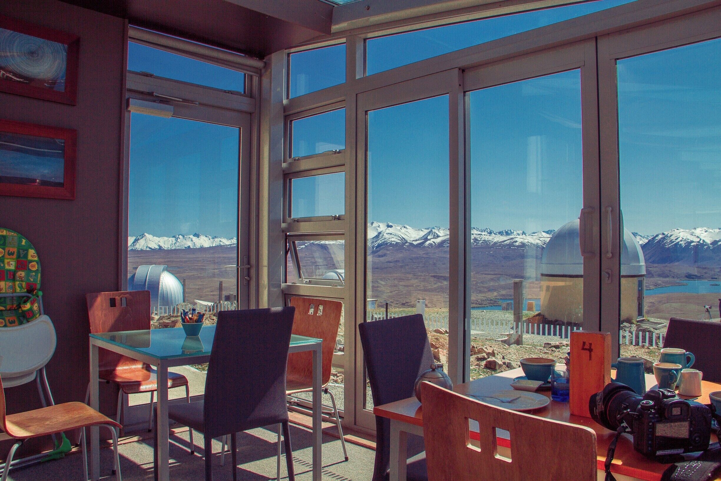 Just after you've passed through Tekapo, or just before you get to Tekapo depending on what way you're driving, you'll have the opportunity to turn down a road that leads you here. 

This is the view from the Astro Cafe set at the top of Mount John with stunning views of Lake Tekapo and the Southern Alps. It does cost $8 to drive up to the observatory, but when you're presented with views like this, then it becomes a bit of a no brainer.